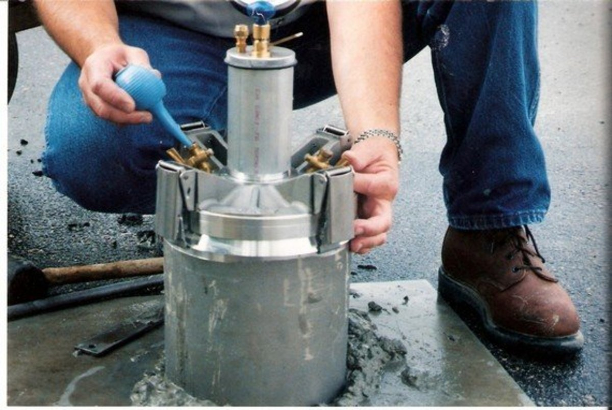An image showing a concrete cylinder being tested for moisture control and air content according to ASTM standards for concrete.